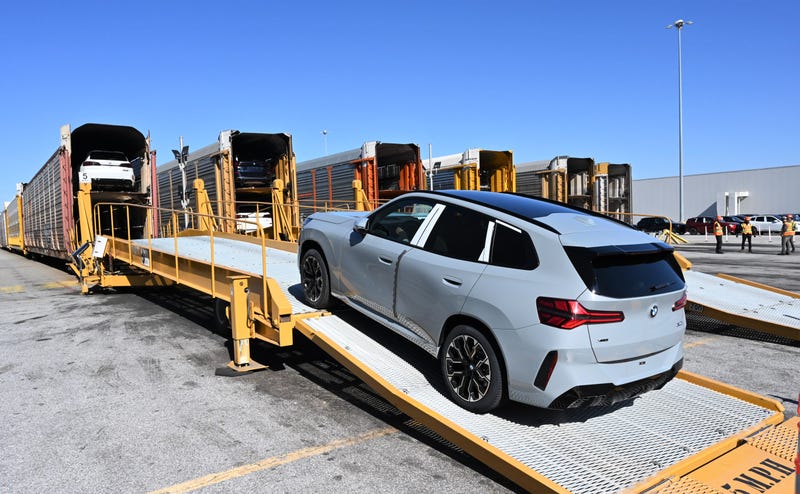 A BMW X3 is loaded onto a railcar at BMW Manufacturing in Spartanburg, SC.