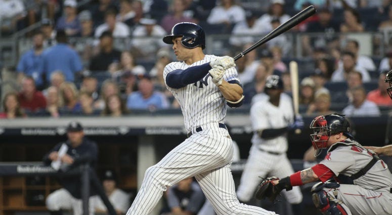 The Yankees' Tyler Austin starts a fight with Boston Red Sox pitcher Joe Kelly (56) during the seventh inning on April 11, 2018, at Fenway Park.