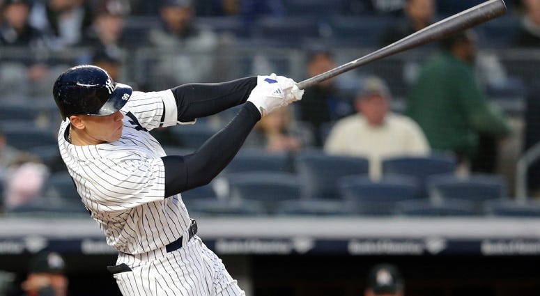 The Yankees' Aaron Judge follows through on a solo home run against the Miami Marlins on April 16, 2018, at Yankee Stadium.