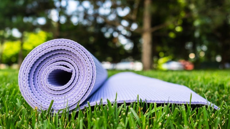 Yoga mat on grass Getty Images
