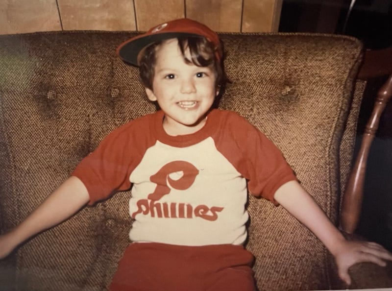 Young boy in Phillies hat and shirt