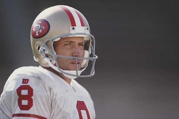 Steve Young looks on with the 49ers.