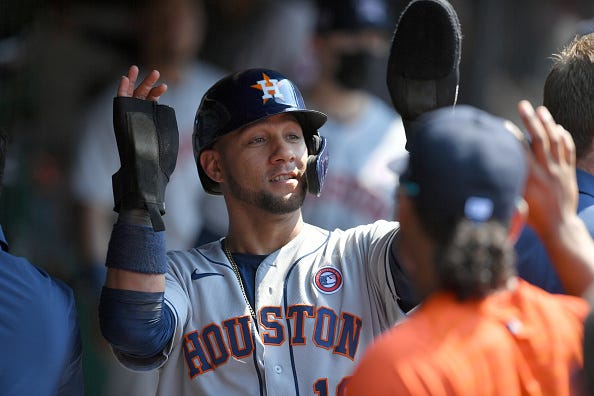 Yuli Gurriel celebrates in the Astros dugout. 