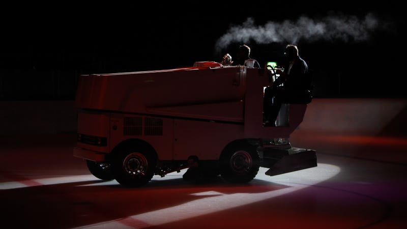 Ice maintenance vehicle preparing the ice surface - stock photo