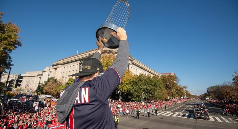 Washington Nationals players and coaches roll through the streets of Washington, D.C. and then speak on stage, celebrating their 2019 World Series championship with a few hundred thousand fans on November 2, 2019. 