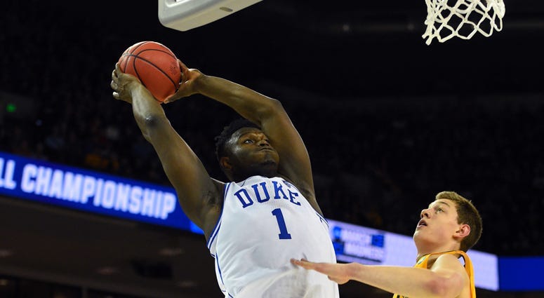 Duke forward Zion Williamson drives to the basket against Michigan State forward Kenny Goins on March 31, 2019, in Washington, D.C.