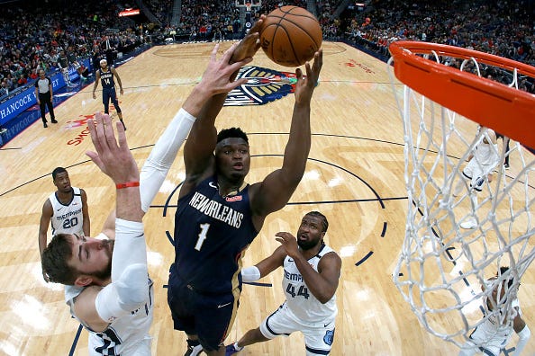 Zion Williamson rises to the hoop during a Pelicans game. 