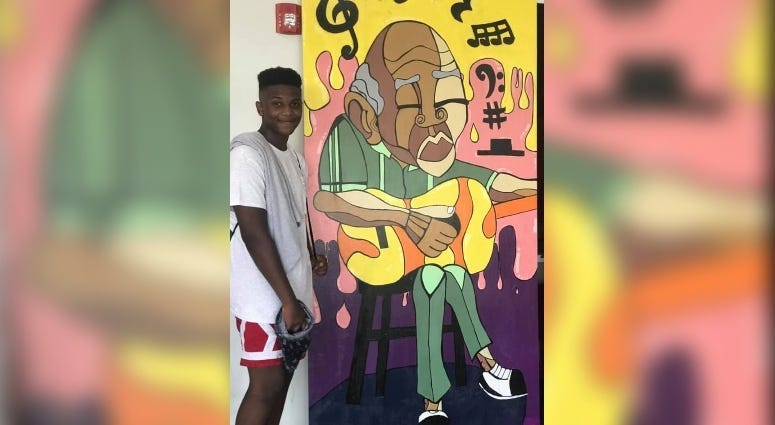 Zion Harrell and mural for Castle Point neighborhood in St. Louis