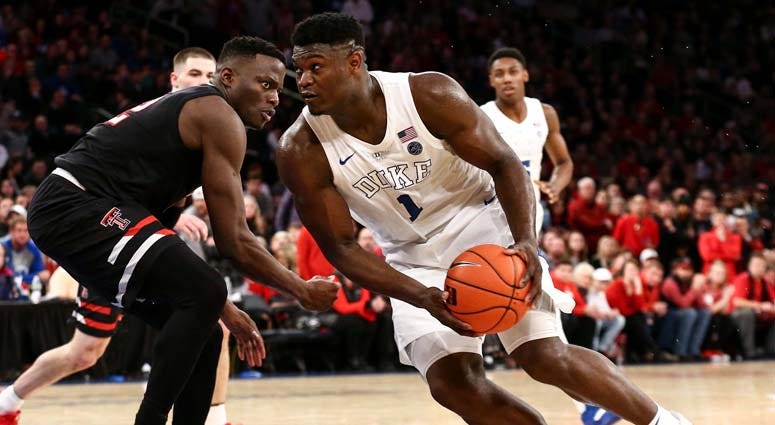 Duke Blue Devils forward Zion Williamson drives to the basket against Texas Tech Red Raiders center Norense Odiase on Dec. 20, 2018, at the Ameritas Insurance Classic at Madison Square Garden.