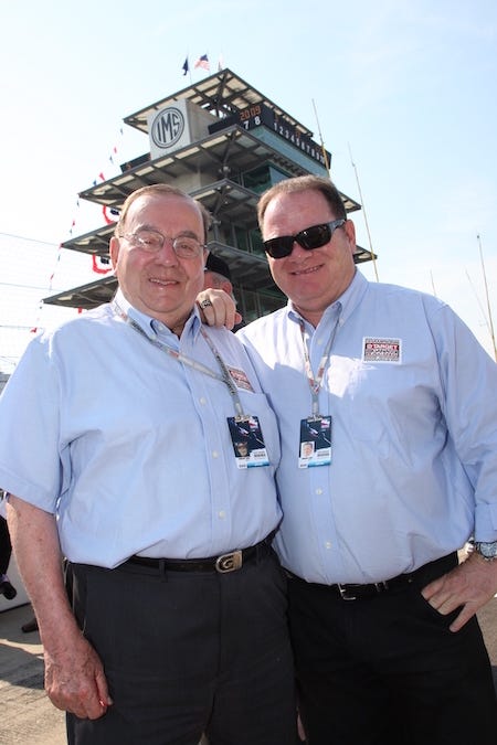 Floyd and Chip Ganassi on Pit Road At The Indianapolis Motor Speedway With The Pagoda In The Background