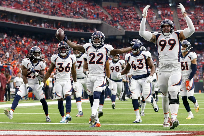 Kareem Jackson #22 of the Denver Broncos celebrates with temmates after an interception in the fourth quarter against the Houston Texans at NRG Stadium on December 8, 2019 in Houston, Texas. 