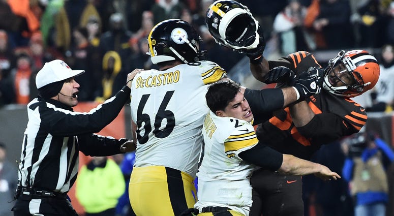 Browns defensive end Myles Garrett hits Steelers quarterback Mason Rudolph with his own helmet on Nov. 14, 2019, in Cleveland.