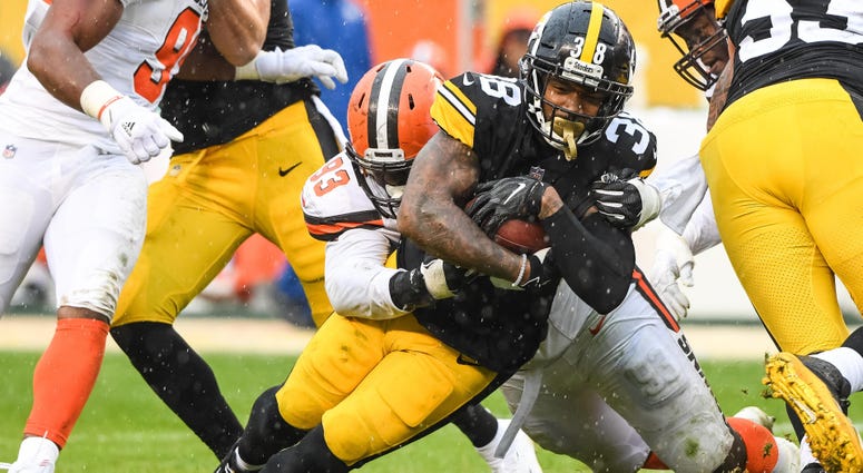 Oct 28, 2018; Pittsburgh, PA, USA; Pittsburgh Steelers running back Jaylen Samuels (38) and Cleveland Browns defensive tackle Trevon Coley (93) in action during the game at Heinz Field. Mandatory Credit: Jeffrey Becker-USA TODAY Sports