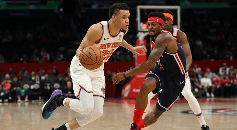 The Knicks’ Kevin Knox dribbles past Bradley Beal of the Wizards on March 10, 2020, in Washington.