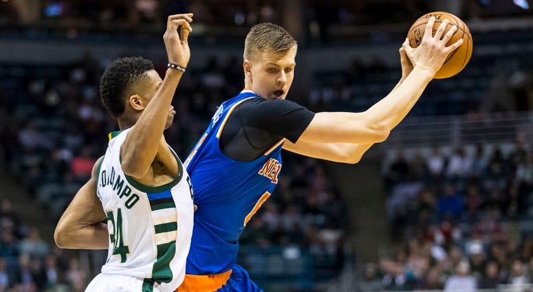 Knicks forward Kristaps Porzingis holds the ball away from Bucks forward Giannis Antetokounmpo on March 7, 2017, at BMO Harris Bradley Center in Milwaukee.