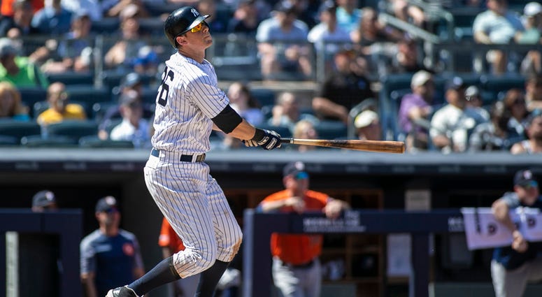 New York Yankees third baseman DJ LeMahieu (26) hits a three run home run in the fifth inning against the Houston Astros at Yankee Stadium on June 23, 2019.