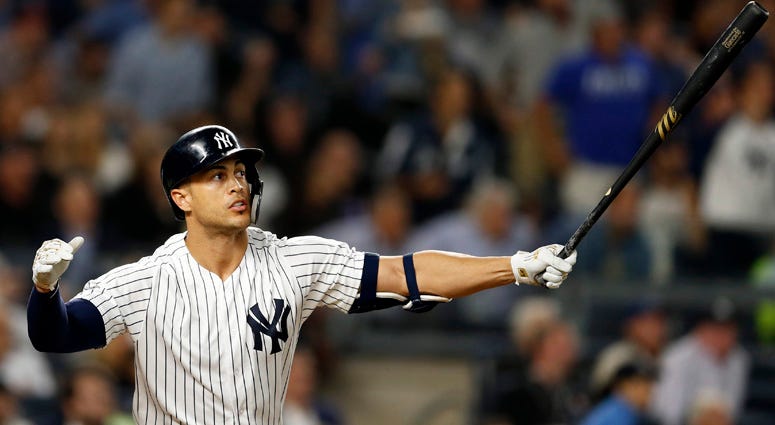 The Yankees' Giancarlo Stanton hits a grand slam against the Boston Red Sox on Sept. 20, 2018 at Yankee Stadium.