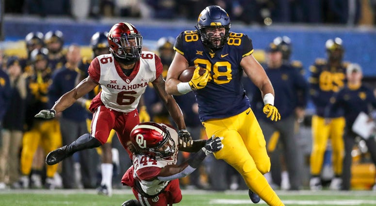West Virginia tight end Trevon Wesco runs after a catch against the Oklahoma Sooners on Nov. 23, 218, at Mountaineer Field at Milan Puskar Stadium in Morgantown, West Virginia.
