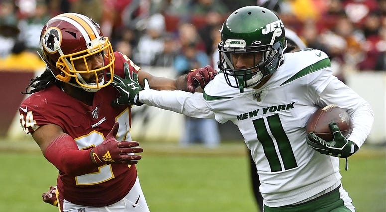 Nov 17, 2019; Landover, MD, USA; New York Jets wide receiver Robby Anderson (11) runs after a catch against Washington Redskins cornerback Josh Norman (24) during the first half at FedExField