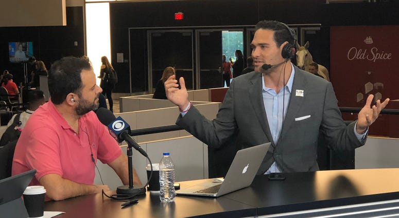 Former Jets quarterback Mark Sanchez chats with WFAN's Gregg Giannotti on Jan. 29, 2019, on Super Bowl Radio Row in Miami Beach, Florida. 