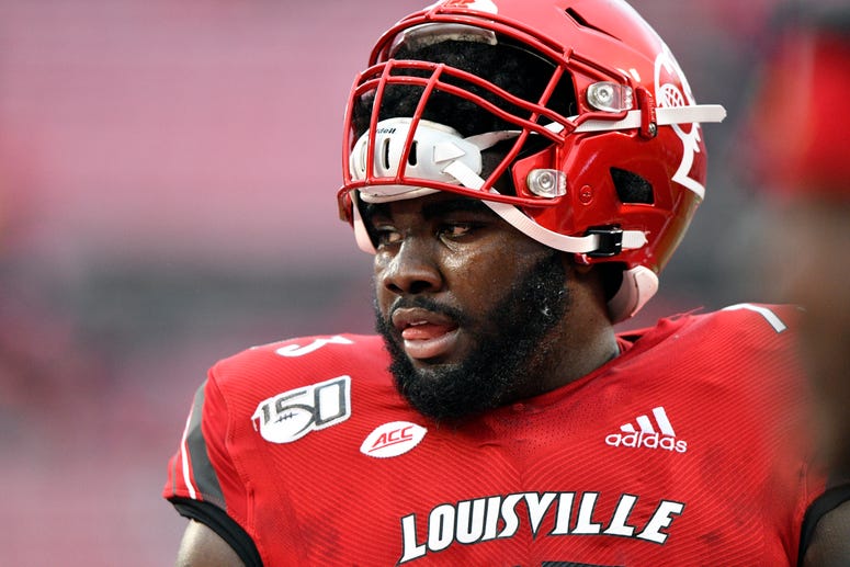 Louisville OT Mekhi Becton takes his helmet off. 