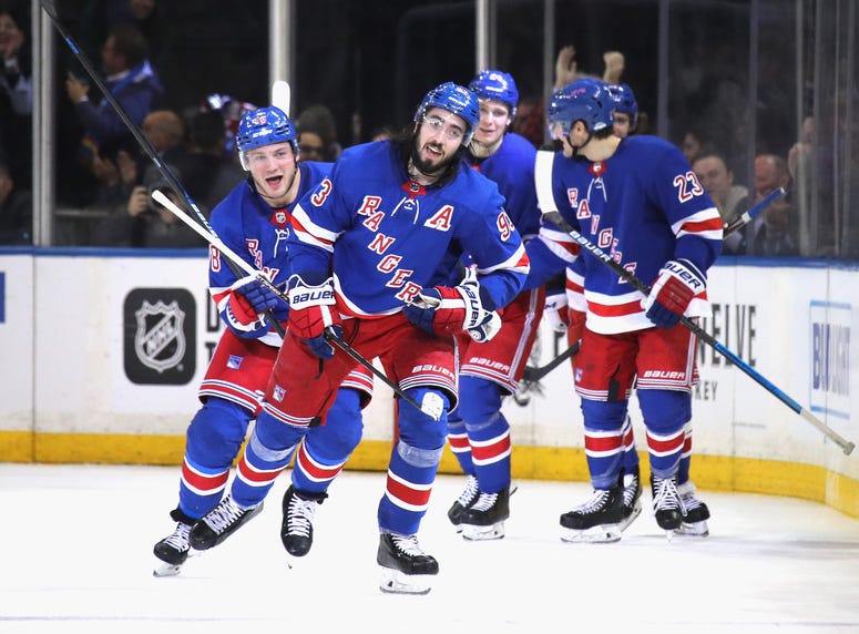 The laces on the Rangers' hallmark collar can be seen hanging from Mike Zibanejad's uniform.