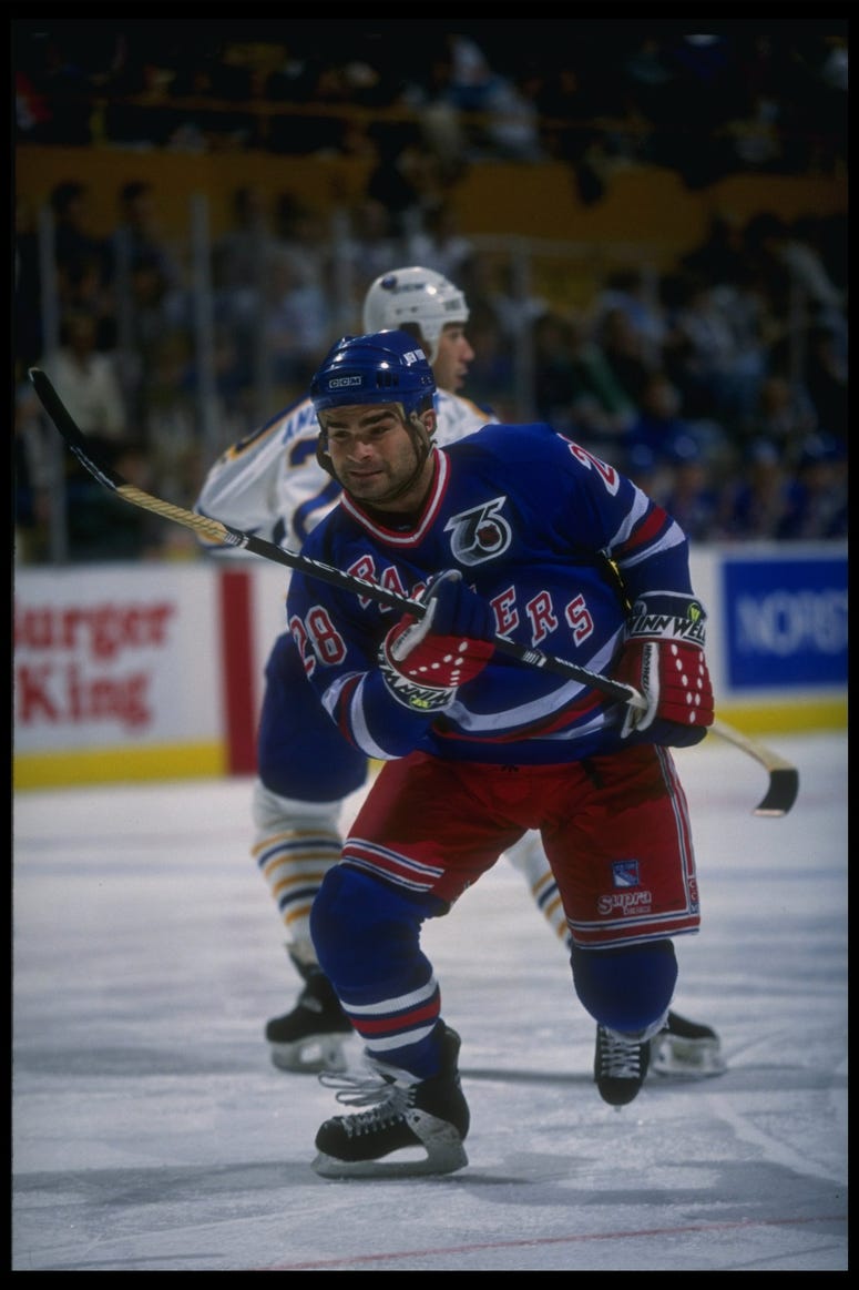 Tie Domi chases down a loose puck against the Sabres in November 1991.