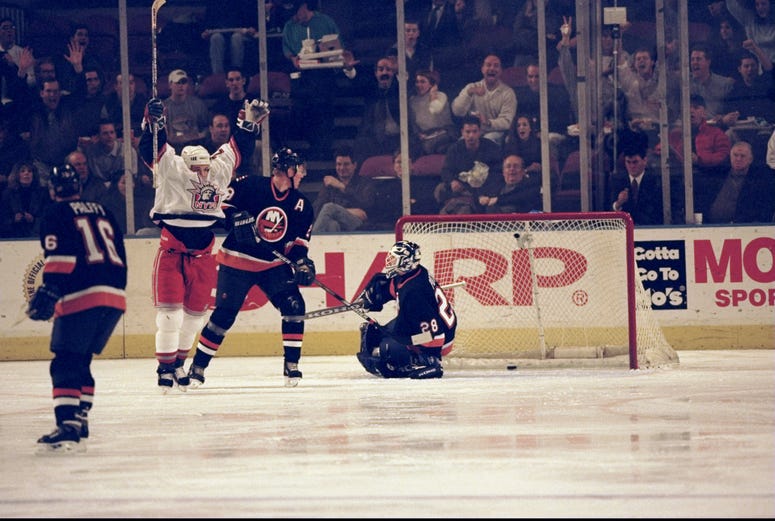 Todd Harvey celebrates a goal in the so-called White Liberty jersey, a rare collector's item.