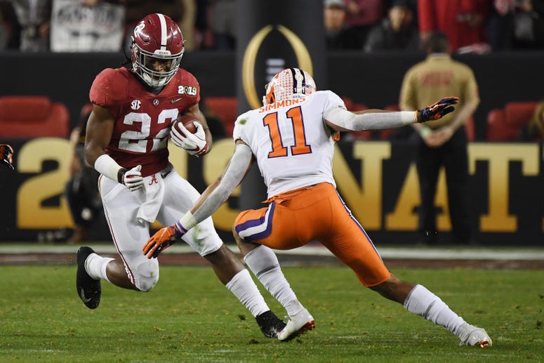 Najee Harris of the Alabama Crimson Tide runs against Isaiah Simmons of the Clemson Tigers in the CFP National Championship presented by AT&T at Levi's Stadium on January 7, 2019 in Santa Clara, California.