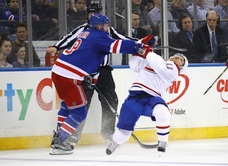 Kevin Klein of the Rangers hits Brendan Gallagher of the Montreal Canadiens during the first period in Game Three of the Eastern Conference First Round during the 2017 NHL Stanley Cup Playoffs at Madison Square Garden on April 16, 2017 in New York City.
