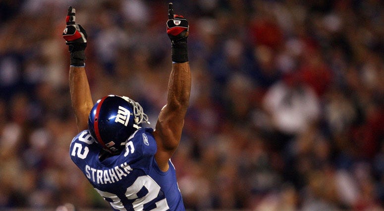 Michael Strahan celebrates after becoming the Giants’ all-time sack leader against the Philadelphia Eagles at Giants Stadium on Sept. 30, 2007. 