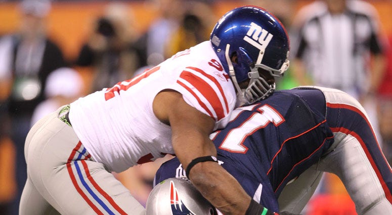 Patriots quarterback Tom Brady is sacked by Giants defensive end Justin Tuck in Super Bowl XLVI.