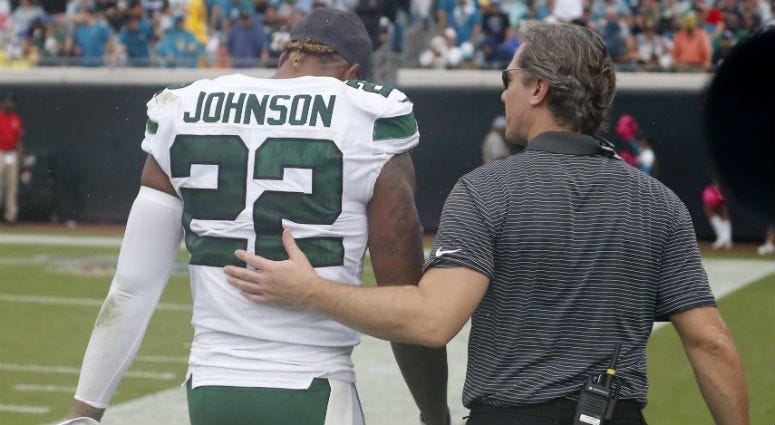 Oct 27, 2019; Jacksonville, FL, USA; An assistant takes New York Jets cornerback Trumaine Johnson (22) to the locker room during the second quarter against the Jacksonville Jaguars at TIAA Bank Field.