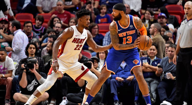 Knicks forward Marcus Morris defended by Miami Heat forward Jimmy Butler Dec 20, 2019; Miami, Florida