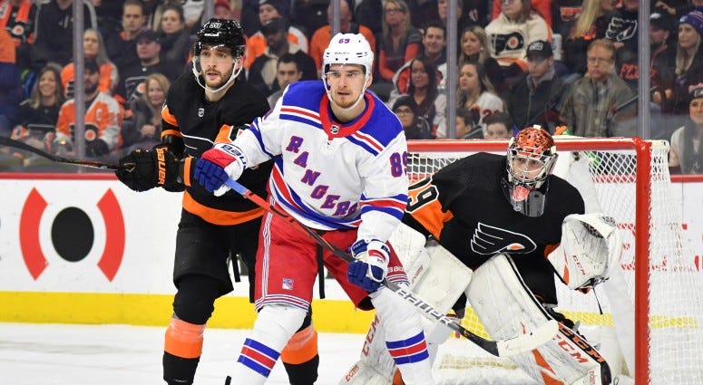New York Rangers right wing Pavel Buchnevich (89) with Philadelphia Flyers defenseman Shayne Gostisbehere (53) in front of goaltender Carter Hart (79) during the first period on Dec 23, 2019 at Wells Fargo Center.