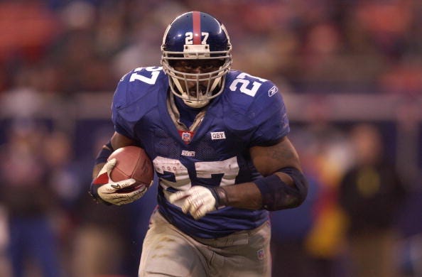 Ron Dayne barrels down the field for the Giants. 