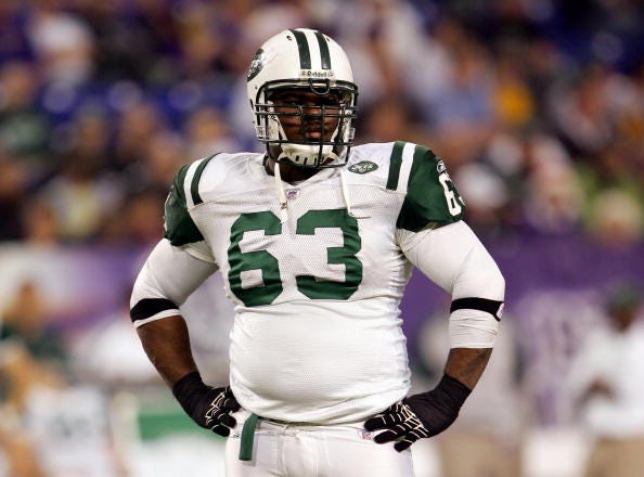Dewayne Robertson looks on during a game with the Jets