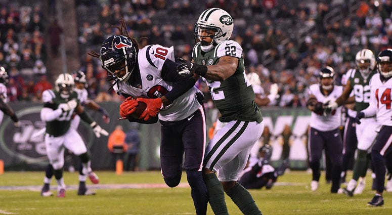 Texans wide receiver DeAndre Hopkins makes a catch against Jets cornerback on Dec. 15, 2018, at MetLife Stadium. 