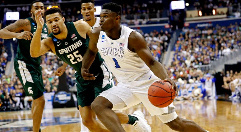 Duke forward Zion Williamson drives to the basket against Michigan State forward Kenny Goins on March 31, 2019, in Washington, D.C.