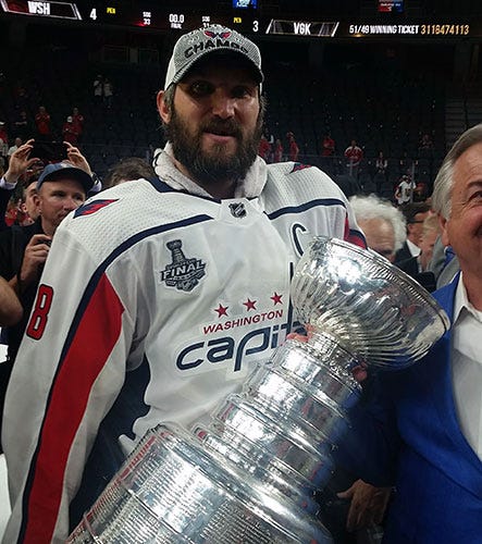 Alex Ovechkin grips the Stanley Cup just minutes after winning it. 